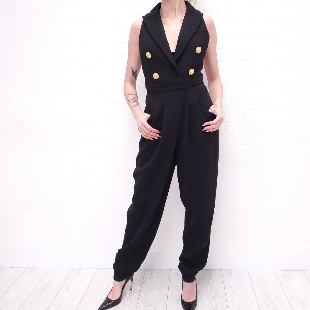 BALMAIN BLACK JUMPSUIT WITH LAPELS AND GOLD LOGO BUTTONS - SIZE XS