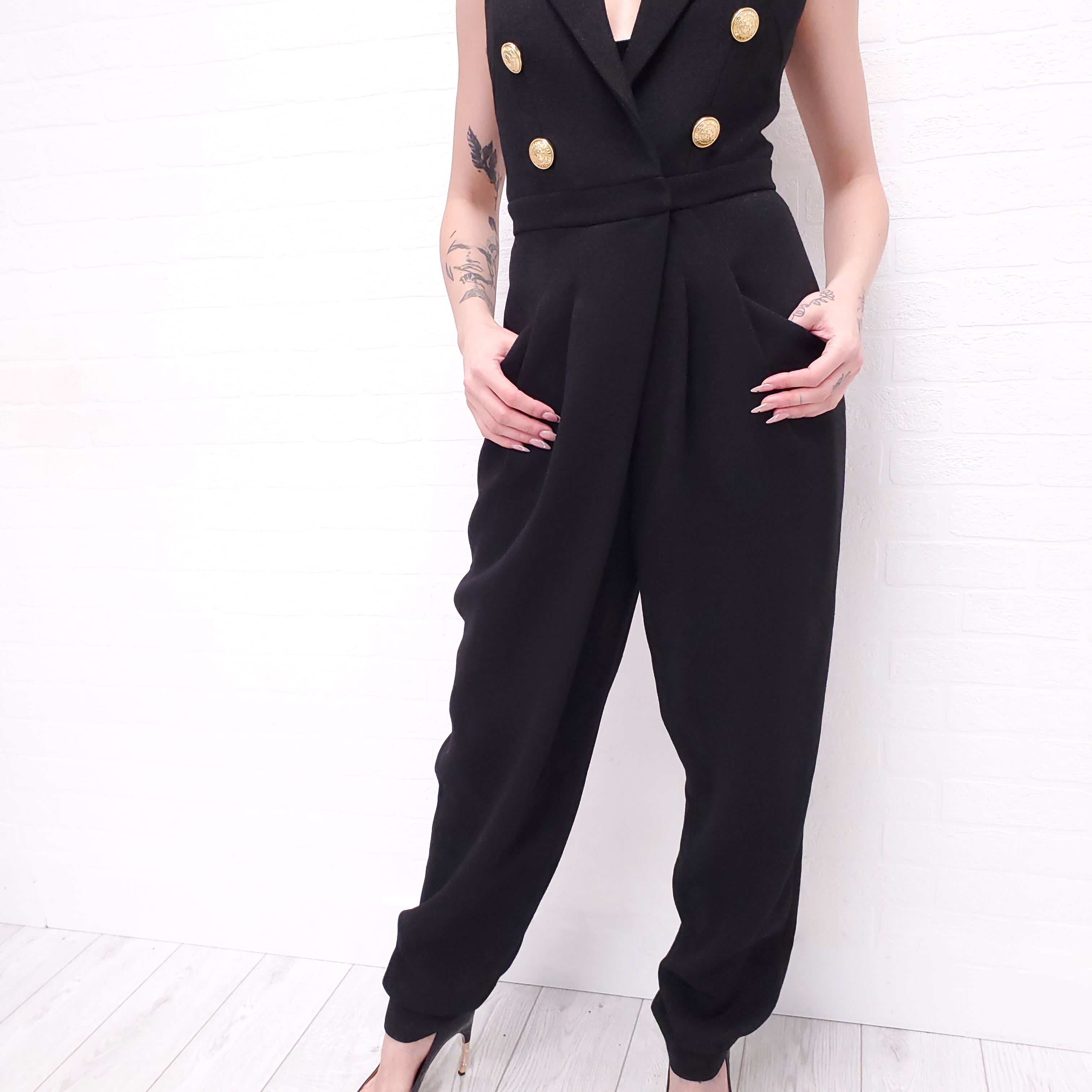 BALMAIN BLACK JUMPSUIT WITH LAPELS AND GOLD LOGO BUTTONS - SIZE XS