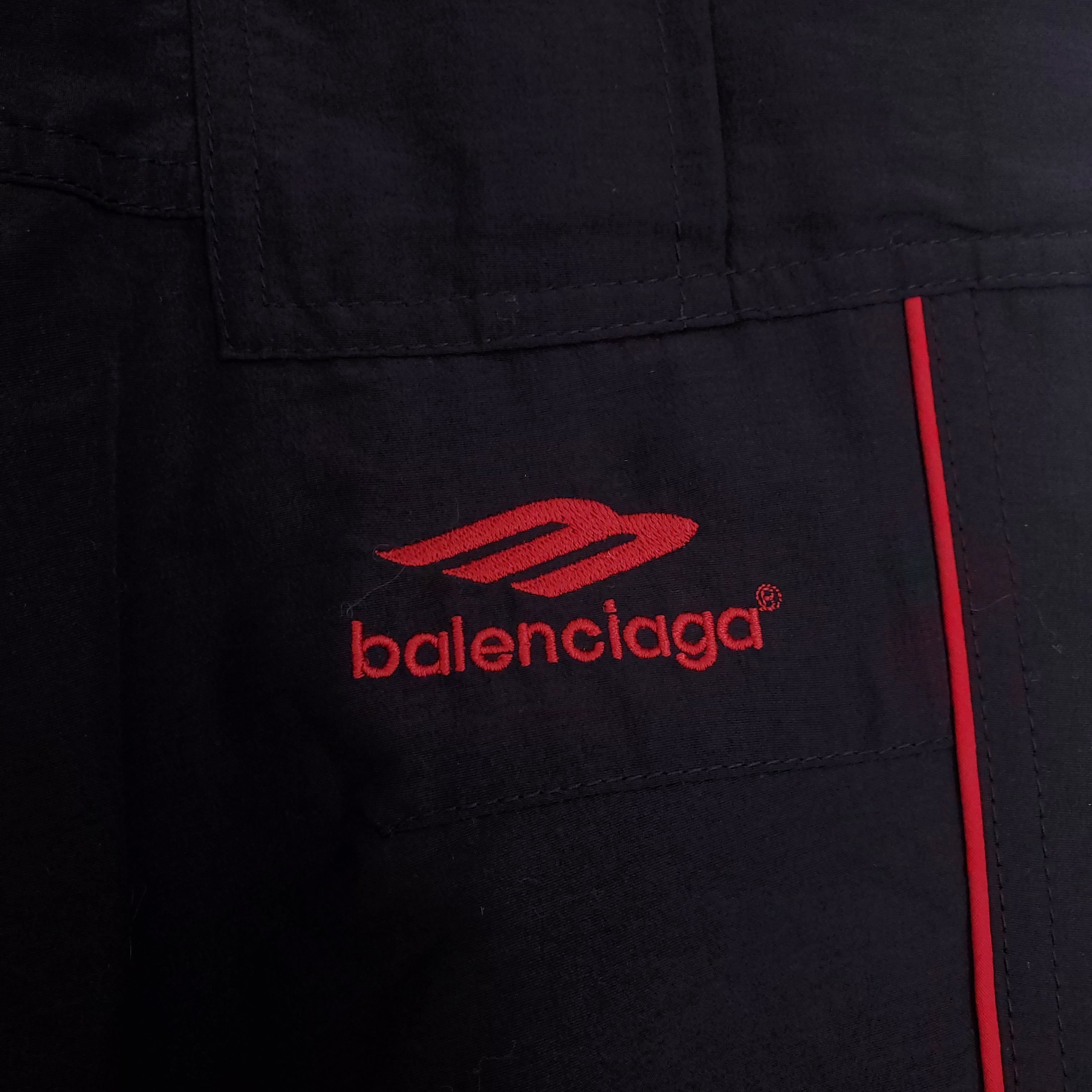 BALENCIAGA UNISEX BLACK CARGO PANTS WITH RED STRIPE - SIZE 48