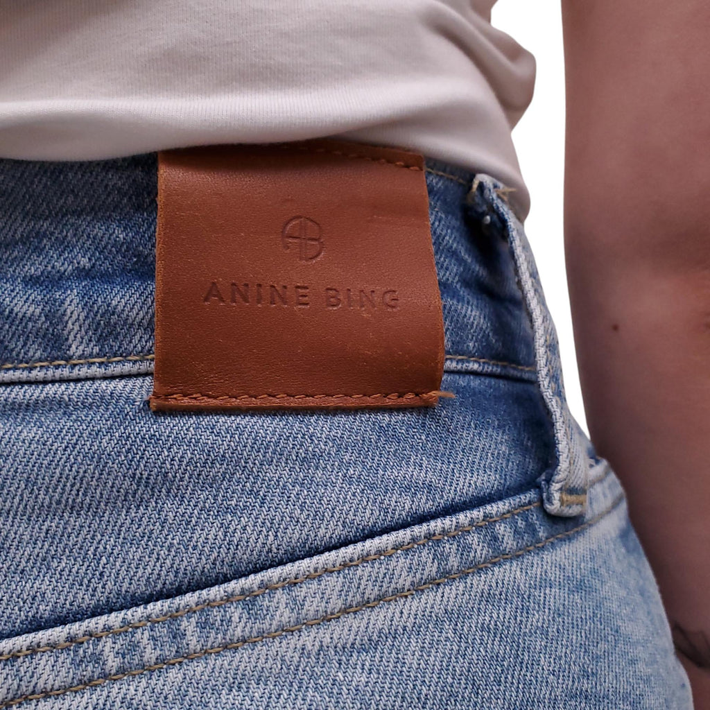 ANINE BING LIGHT WASH JEANS WITH SILVER LOGO BUTTONS - SIZE 24