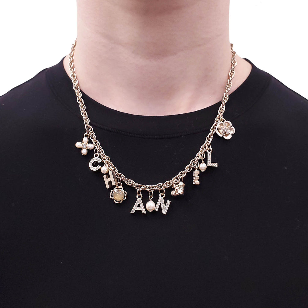 CHANEL GOLD LETTER CRYSTAL FLOWER CHAIN NECKLACE