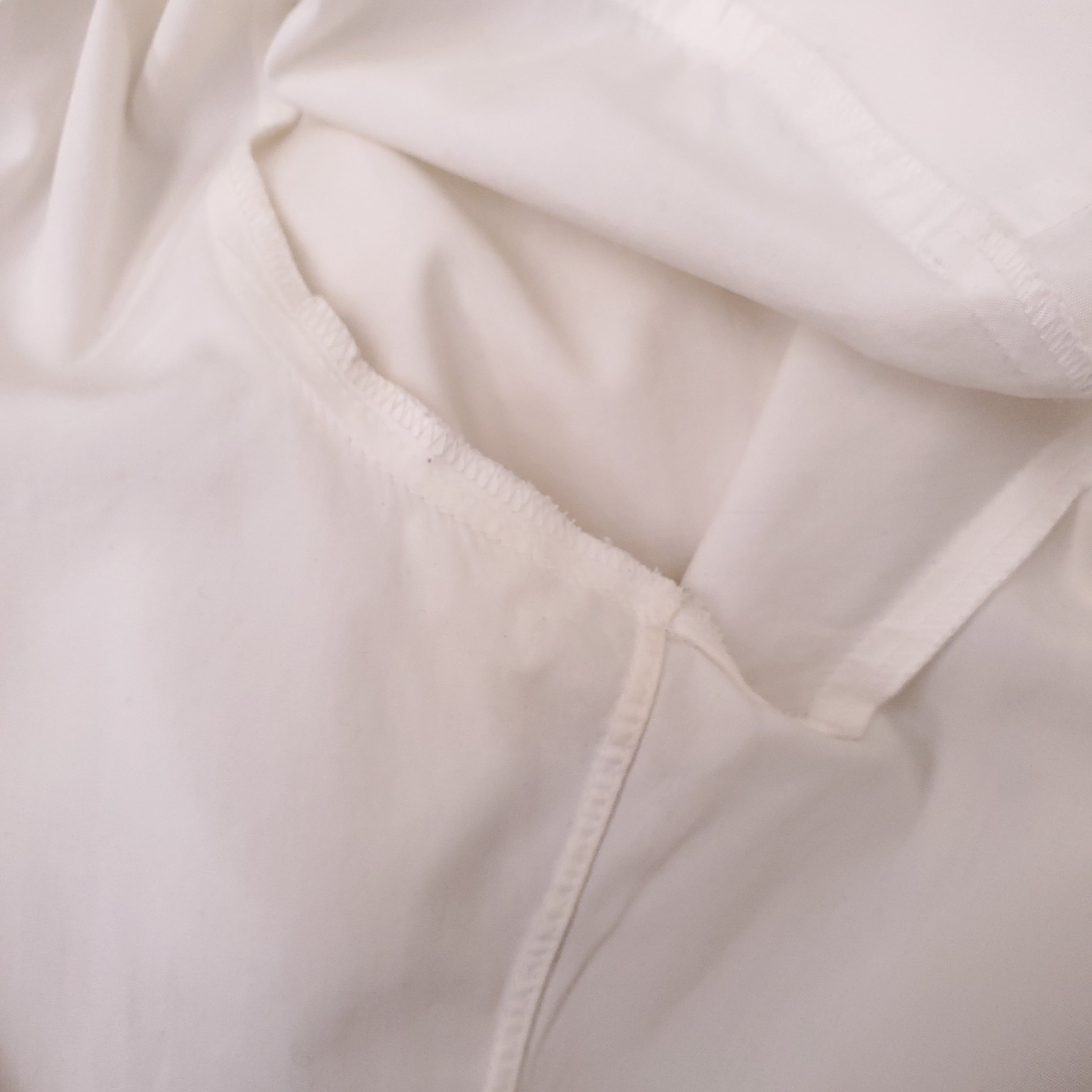 CHANEL WHITE TUXEDO BLOUSE WITH CC PEARL BUTTONS - SIZE 38
