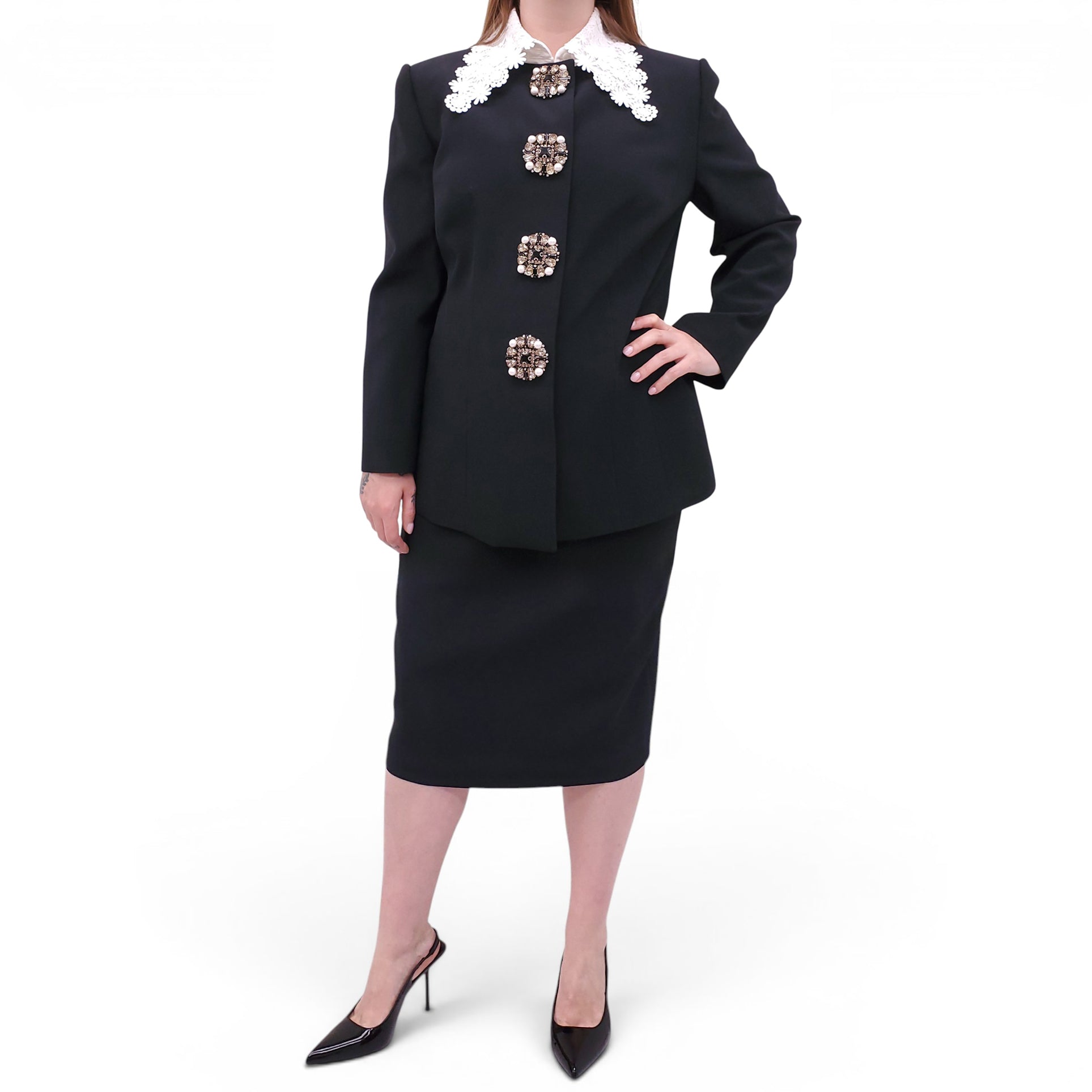 ANDREW GN BLACK SKIRT SUIT WITH FLORAL EYELET COLLAR AND CRYSTAL EMBLEM DETAILS - SIZE 46