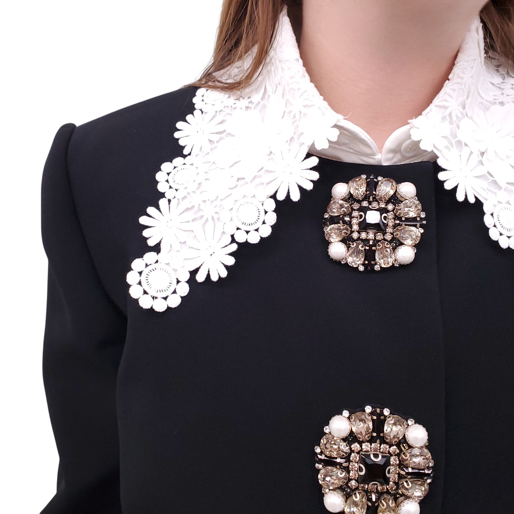 ANDREW GN BLACK SKIRT SUIT WITH FLORAL EYELET COLLAR AND CRYSTAL EMBLEM DETAILS - SIZE 46
