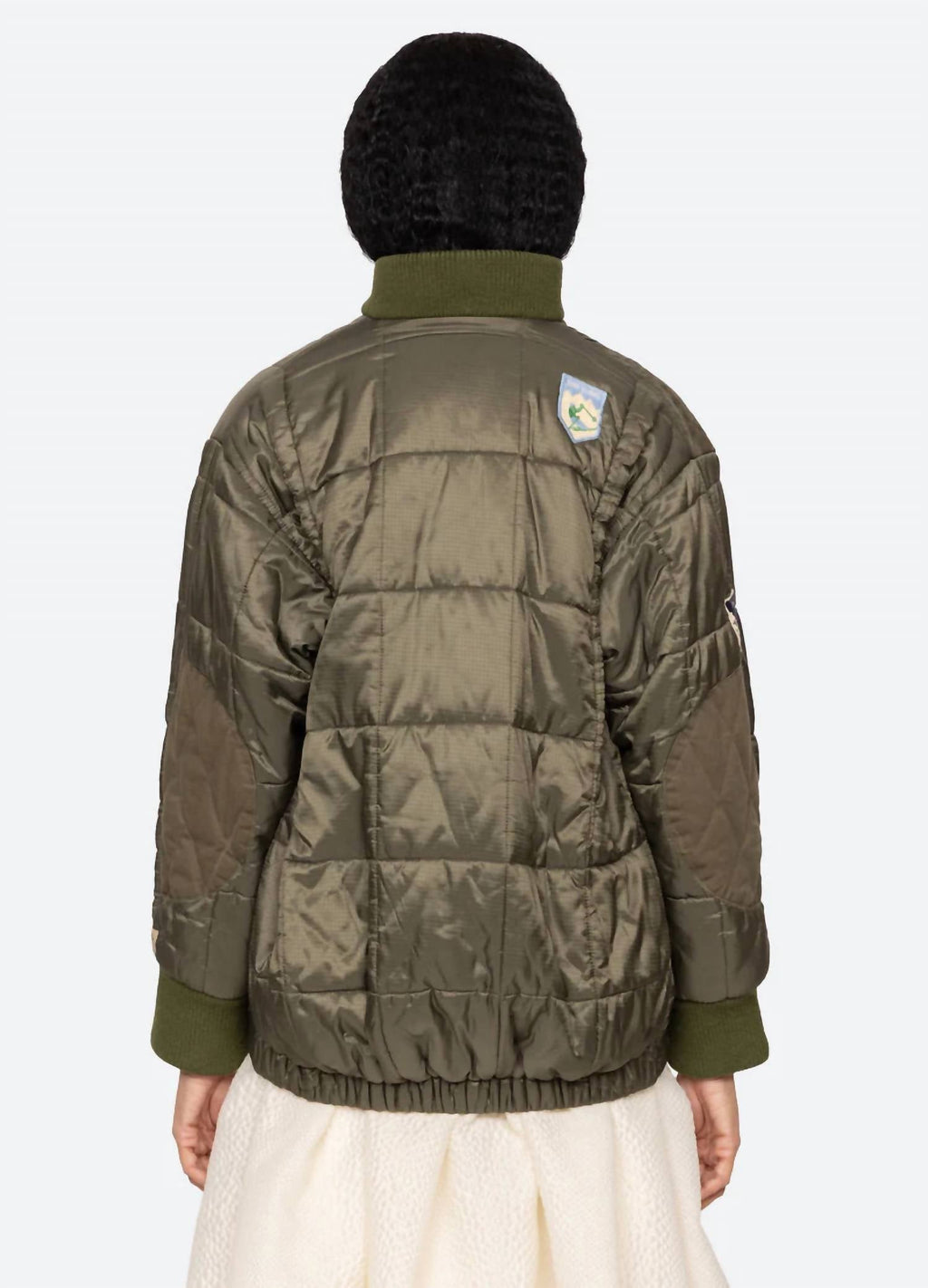 Eira Quilted Patched Puffer Jacket In Sea