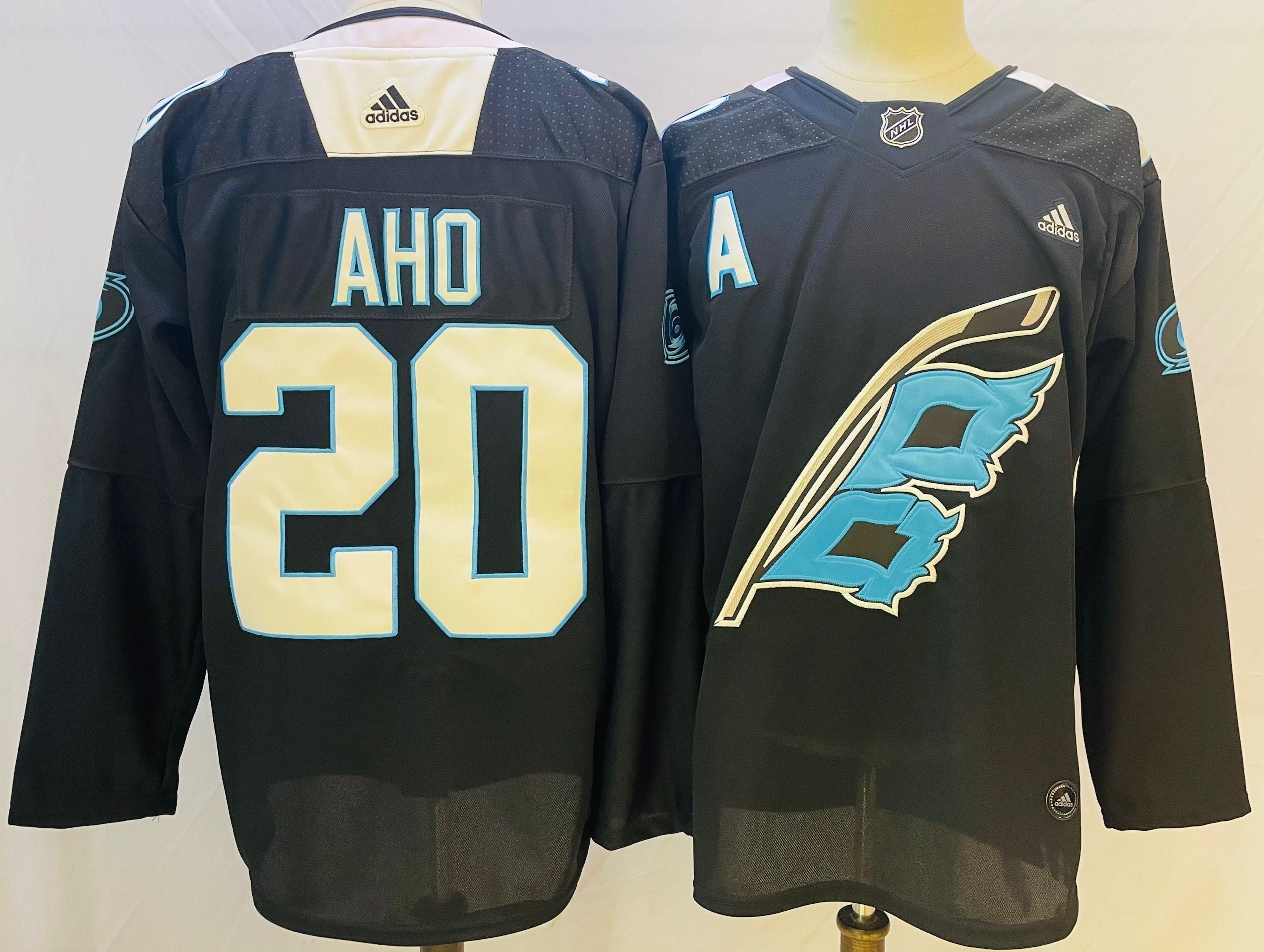 Men's Carolina Hurricanes Sebastian Aho #20 Black Player jersey