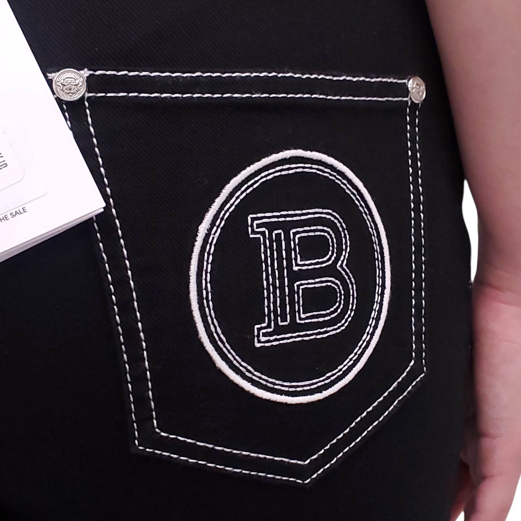 BALMAIN BLACK DENIM PANTS WITH WHITE STITCHING - SIZE 42