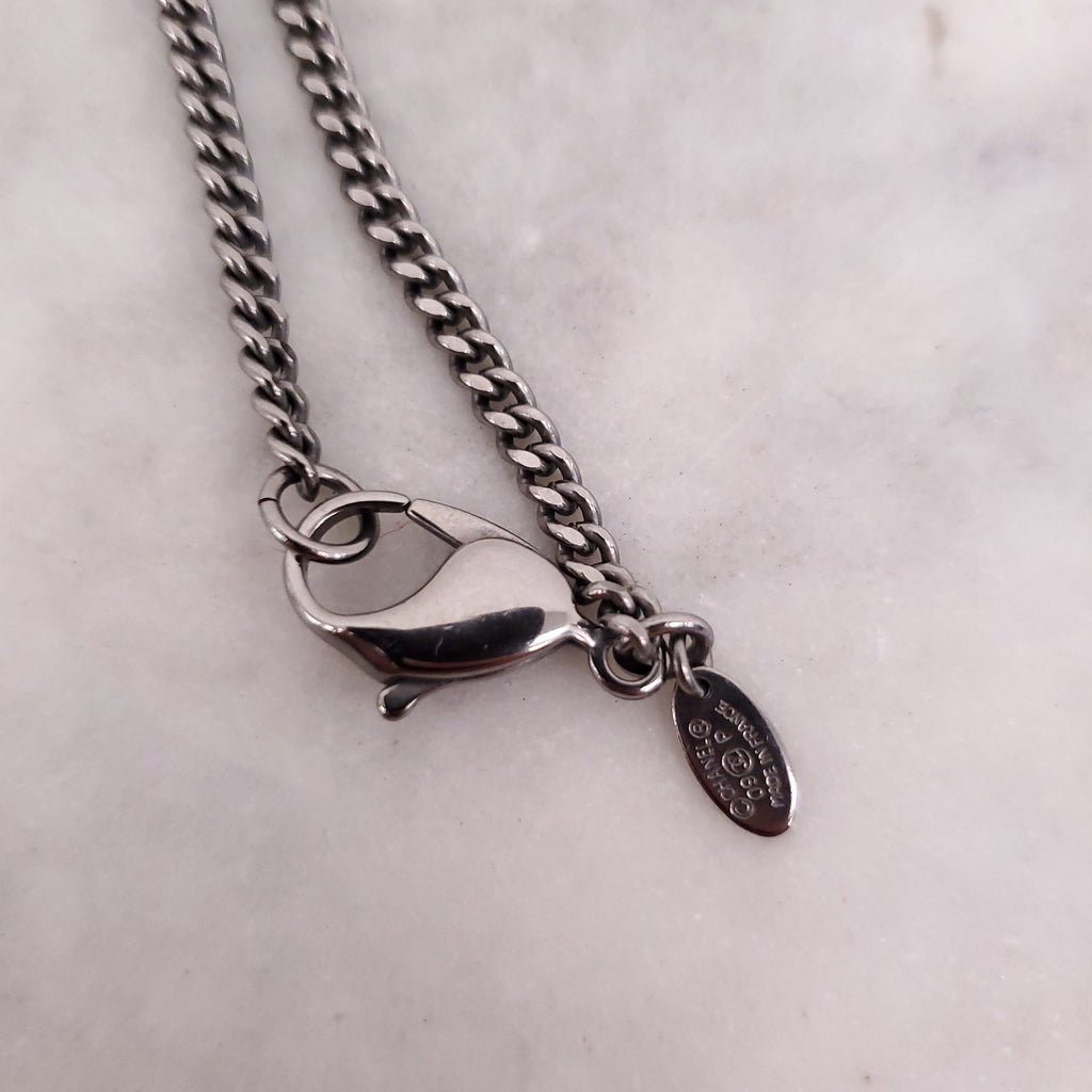 CHANEL BLACK CRYSTAL CROSS WITH LOGO