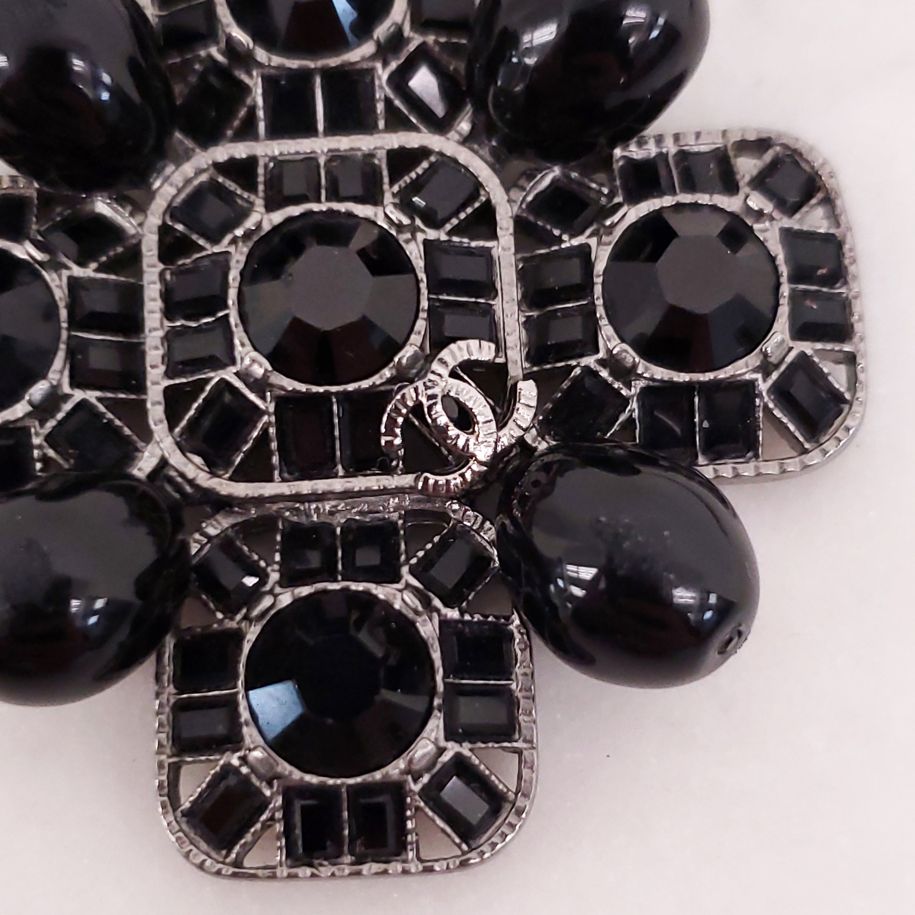 CHANEL BLACK CRYSTAL CROSS WITH LOGO