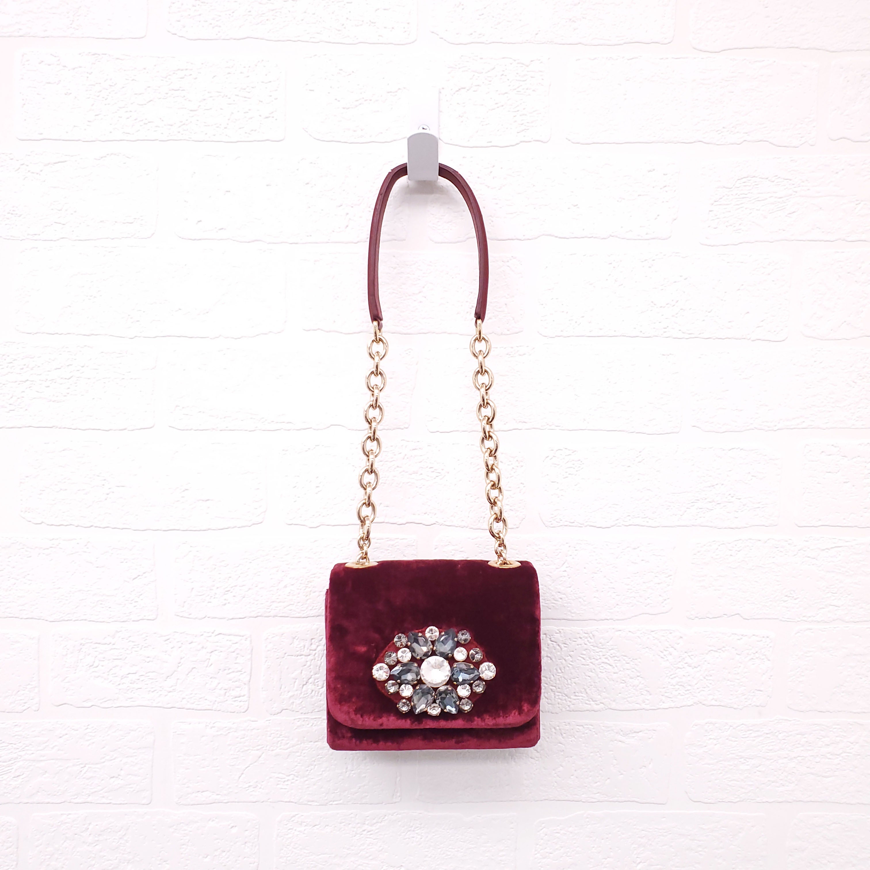 DOLCE & GABBANA BURGUNDY VELVET SHOULDER BAG WITH CRYSTAL EMBLEM