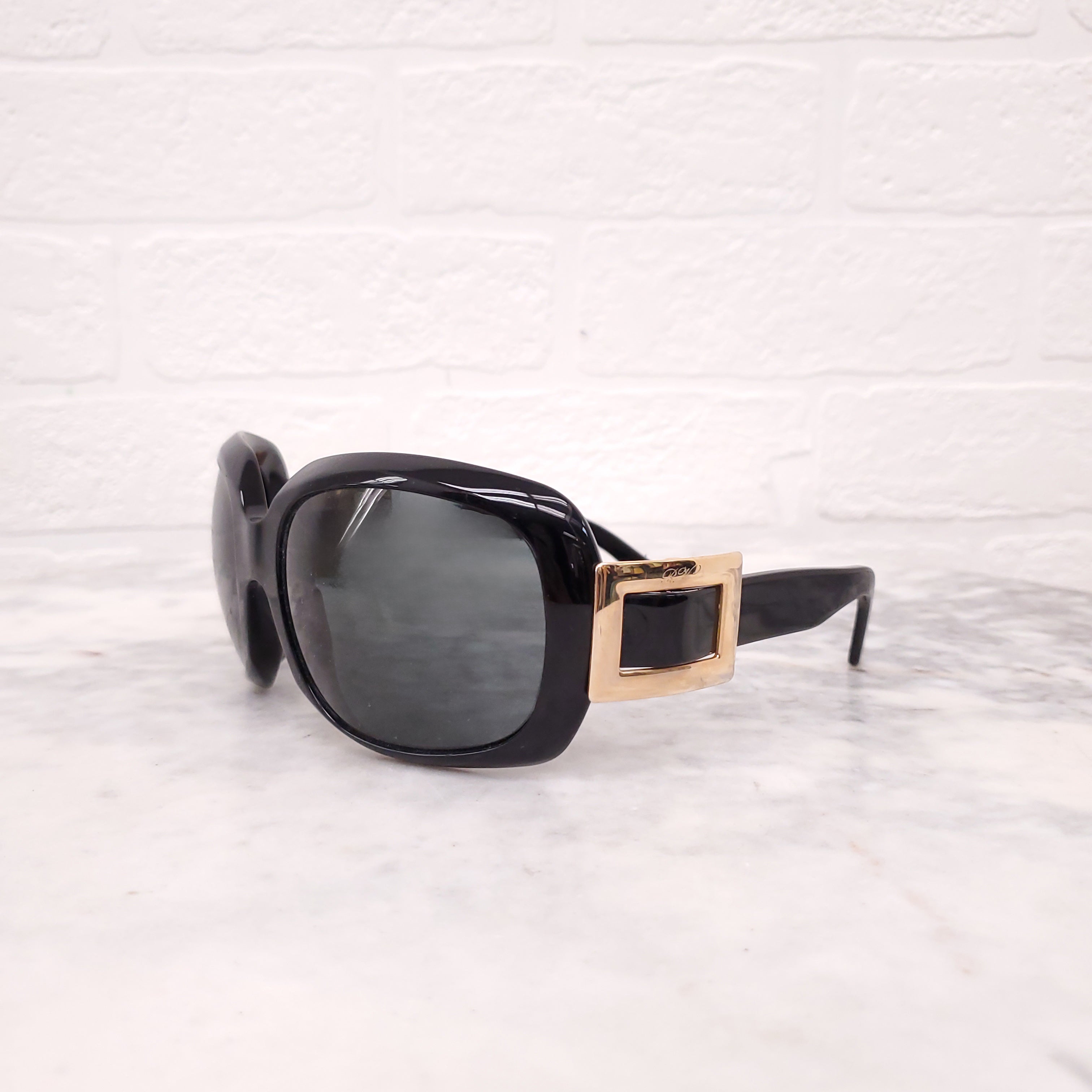 ROGER VIVIER BLACK SUNGLASSES WITH GOLD BUCKLE DETAIL