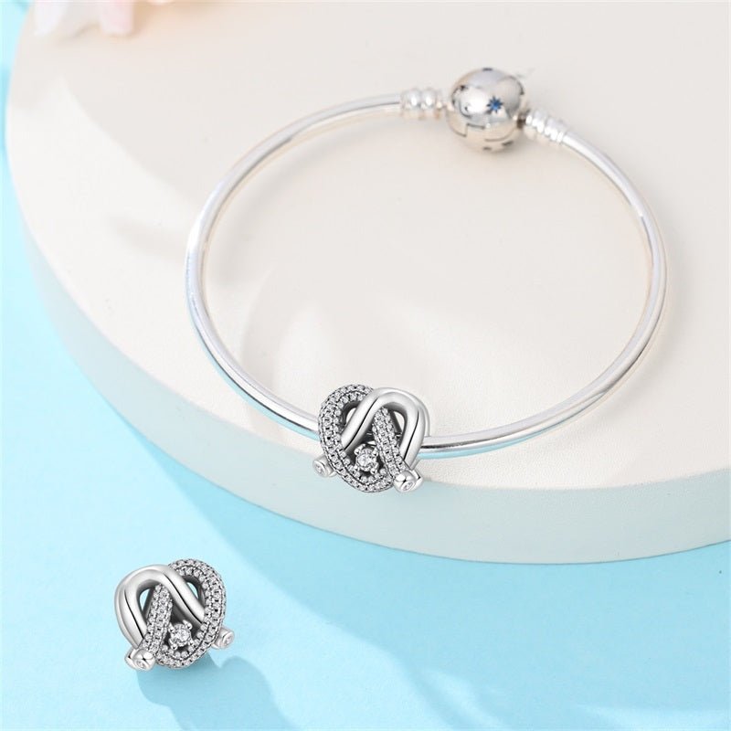 Radiant Love Knot Charm